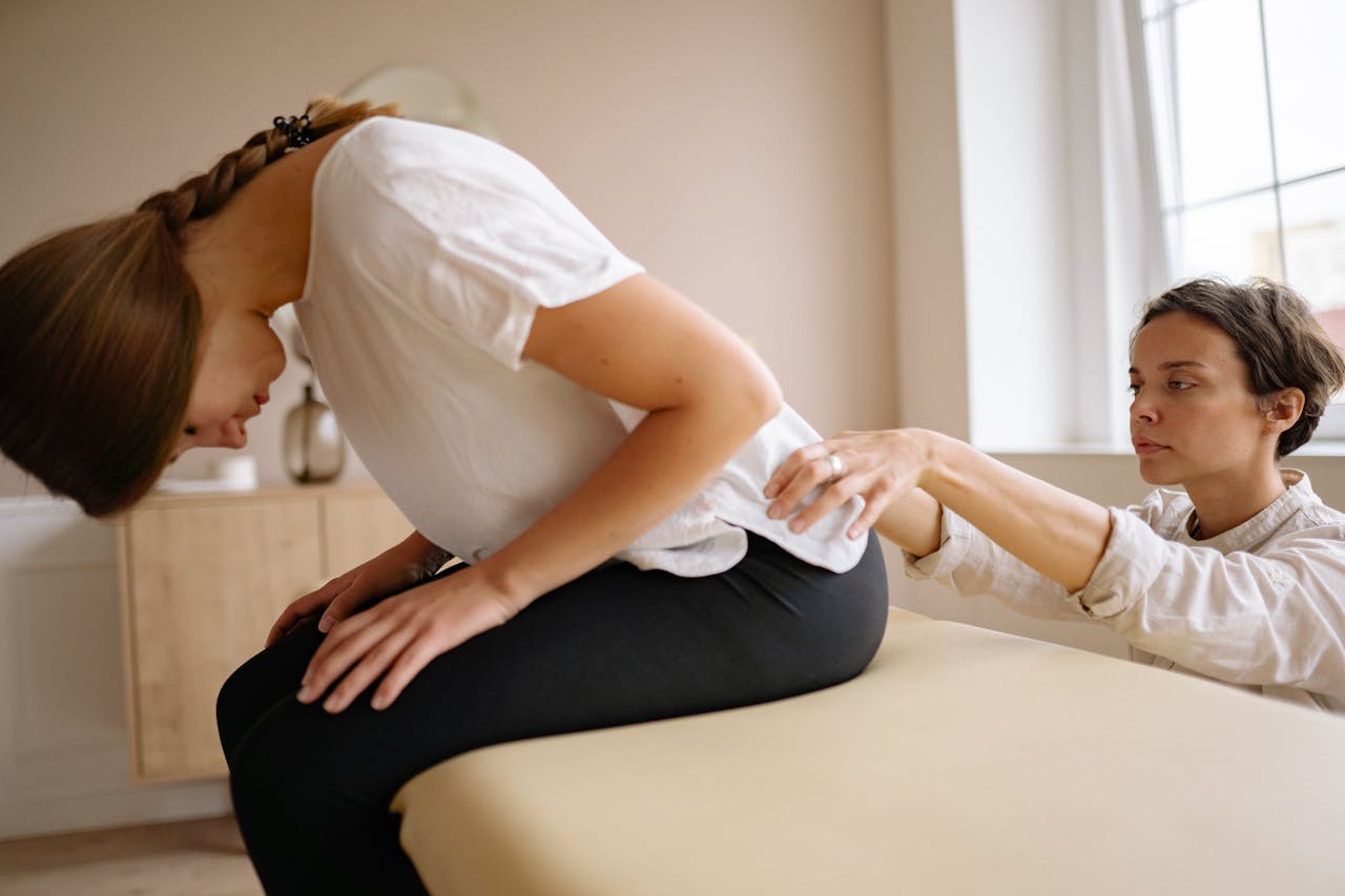 A therapist and client communicate during an active isolated stretching session, emphasizing partnership.