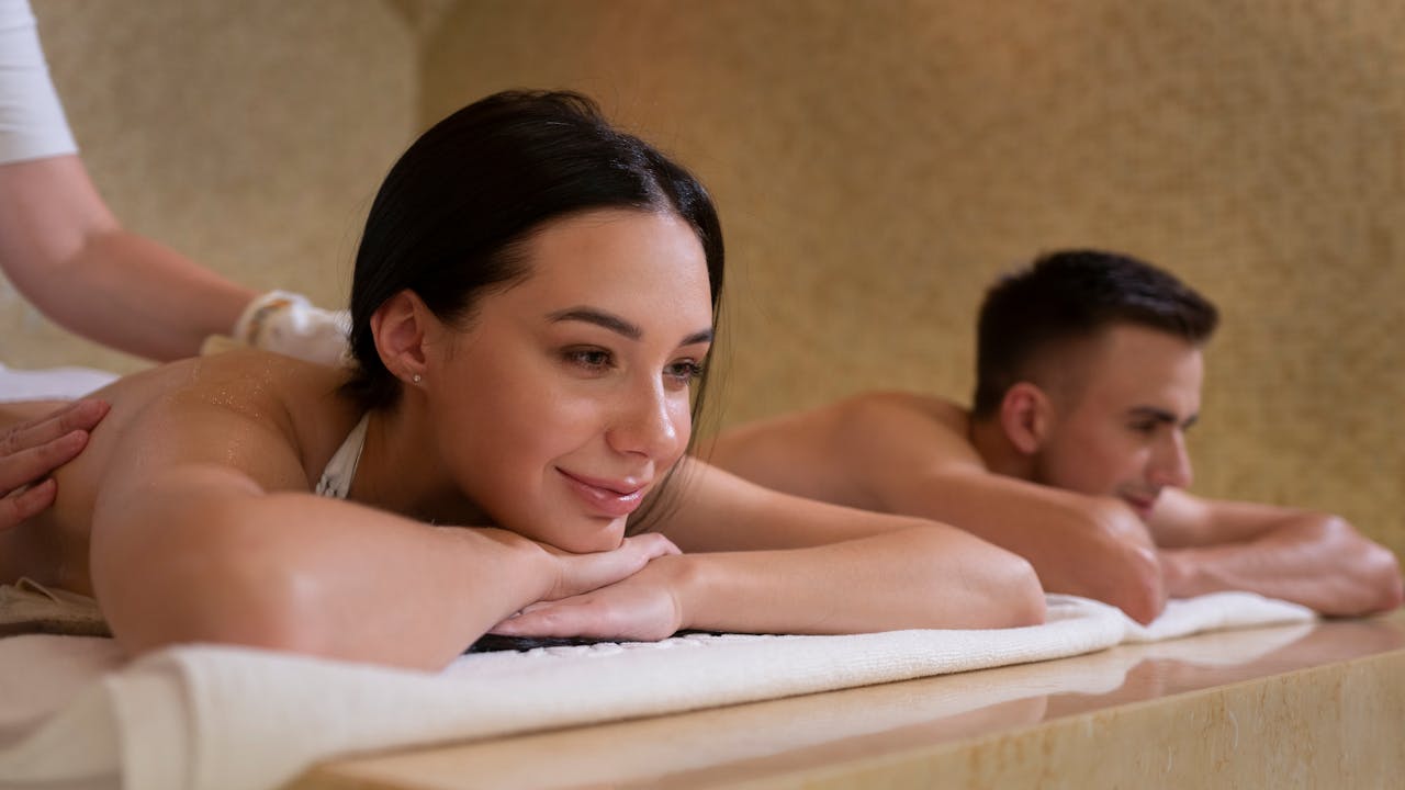 A serene and spacious couple’s massage room ready for a couples massage session.