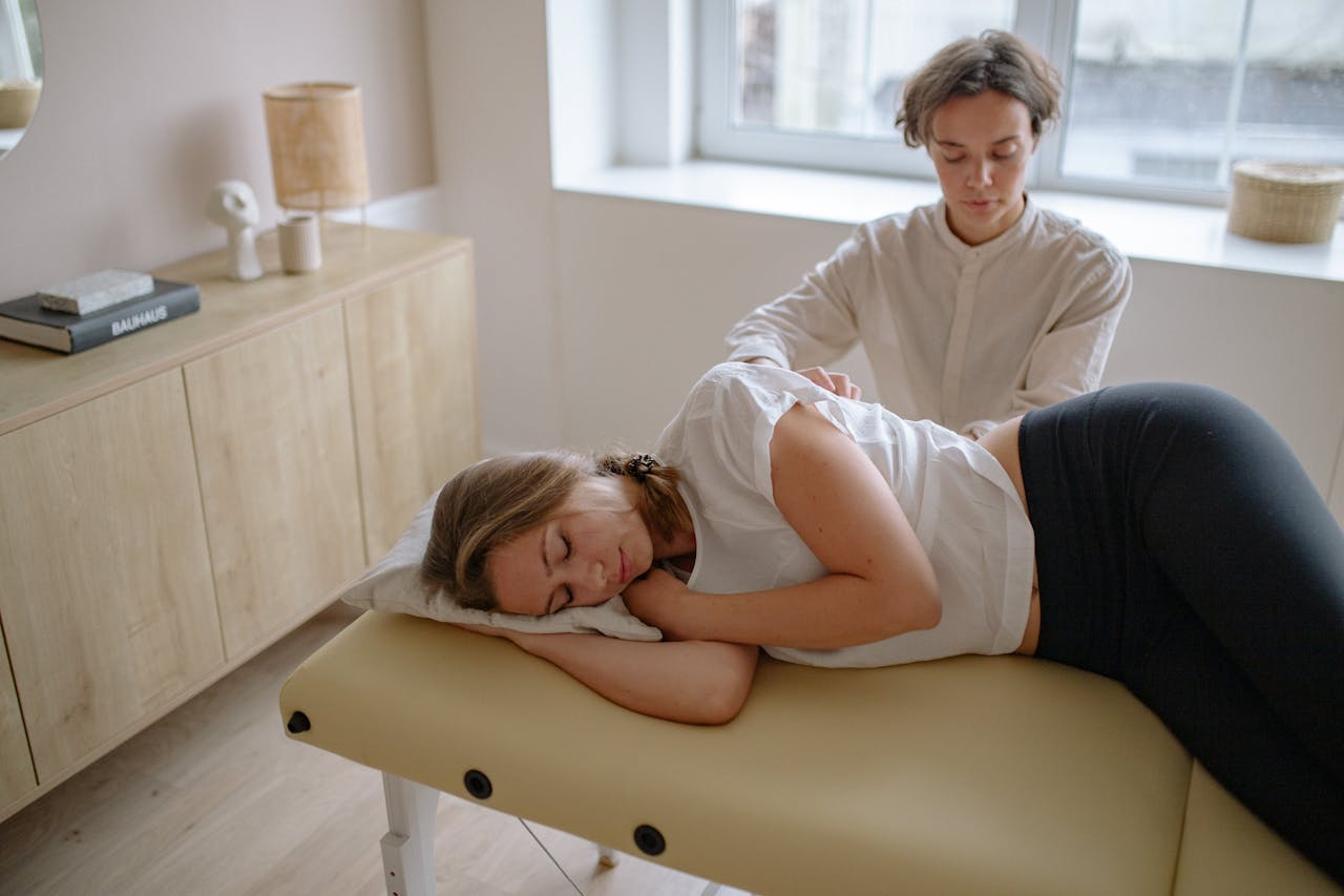 Client receiving medical and recovery massage in the office