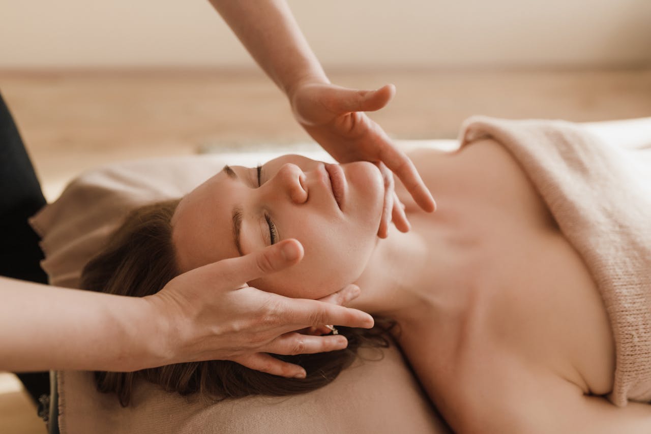 A relaxed lady is reclining during her spa treatment session.