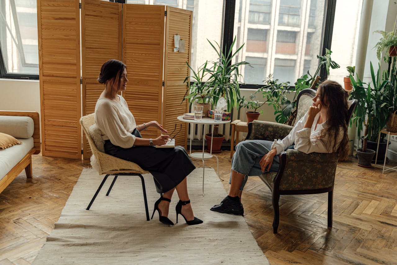 A therapist and client collaboratively review a trauma therapy session plan, emphasizing client choice and consent