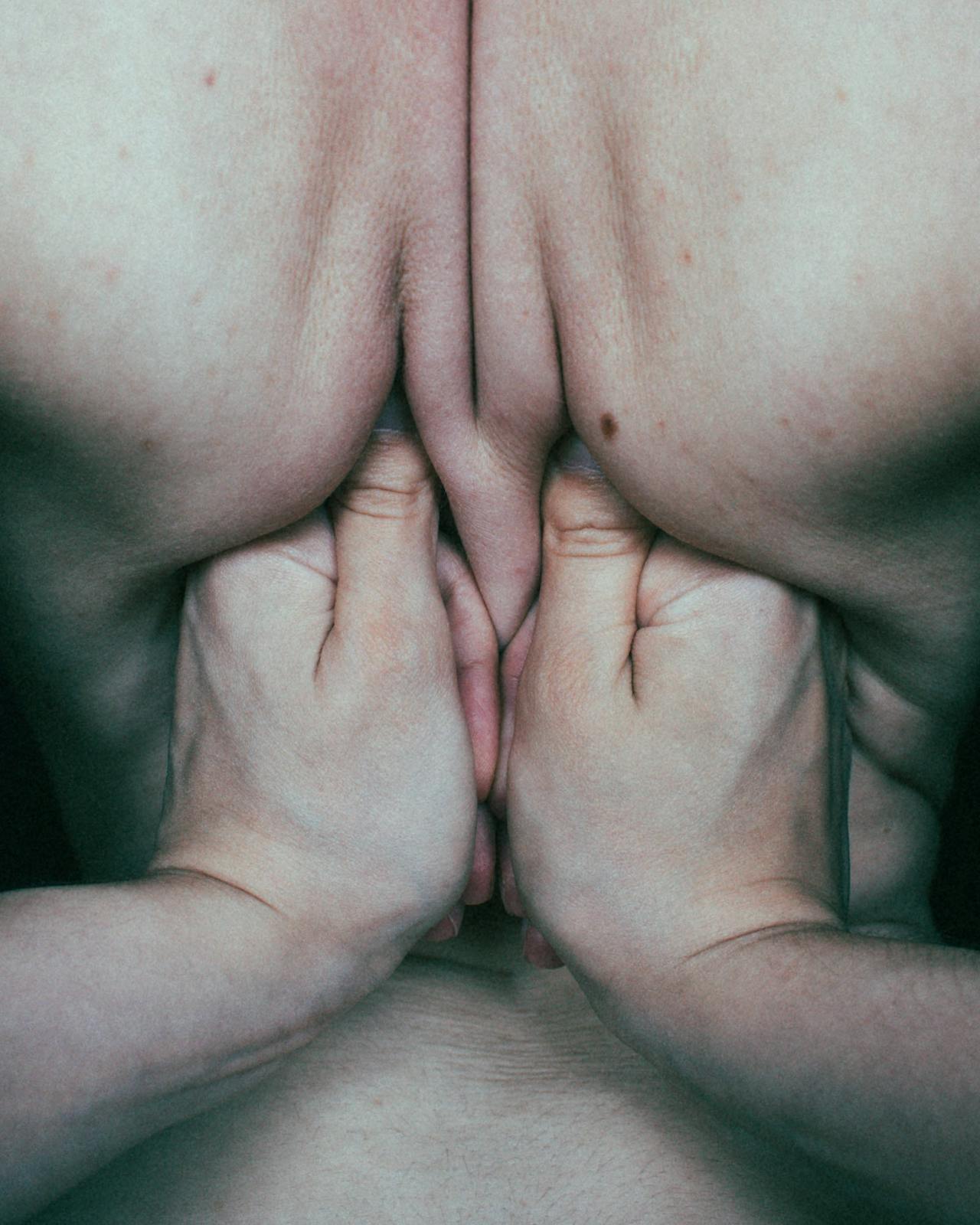 A licensed massage therapist applies focused, sustained pressure to a trigger point during a therapy session.